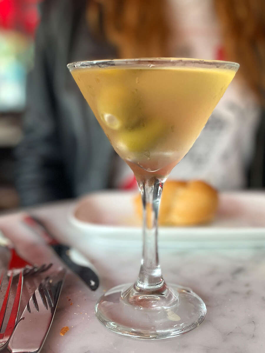 The Gartini, left, a garlic flavored martini, is one of many garlic-heavy menu items at the Stinking Rose.